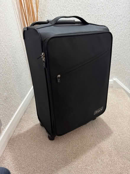 Photo of free Black medium 4 wheel suitcase (Dunfermline KY11) #1