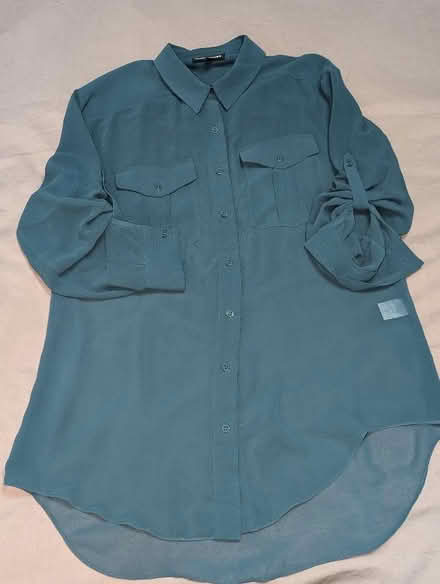 Photo of free Turquoise shirt (Millwall E14) #1