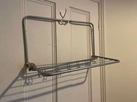 Photo of free Metal shelf with hooks (Fulham Palace Road W6) #1