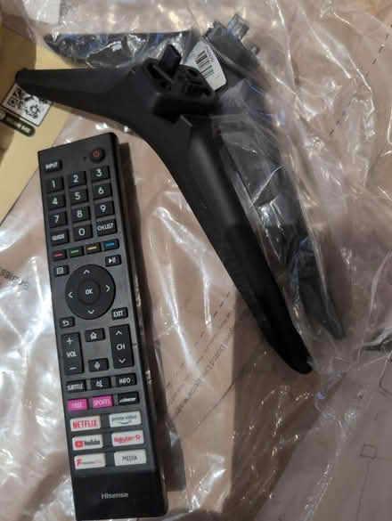 Photo of free Hisense TV remote & stand (South Chailey) #1