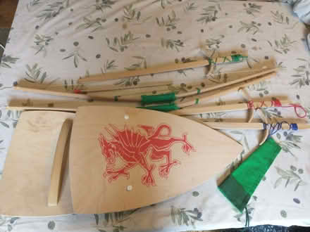 Photo of free English heritage 3 wooden swords, 2 shields, 2 bows/arrows (Wood Green N22) #1