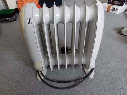 Photo of free Heater - 7 fin plug in oil heater (Sutton Lane Ends SK11) #1
