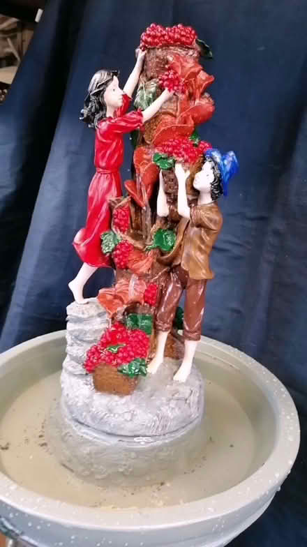 Photo of free Outdoor water feature has 2 figures picking berries (Mickleover DE3) #2