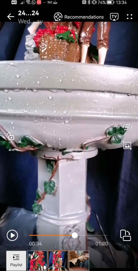 Photo of free Outdoor water feature has 2 figures picking berries (Mickleover DE3) #1