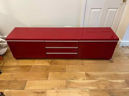 Photo of free Cherry red lacquered TV sideboard in great condition (Fulham Palace Rd W6) #1