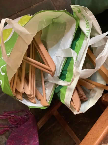 Photo of free 2 bags wooden clothes hangers (Wimborne BH21) #1