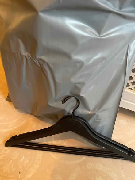 Photo of free 24 wooden black coat hangers (Cheltenham) #1