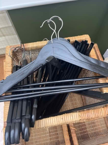 Photo of free Wooden coat hangers x 23 black (Cheltenham) #1