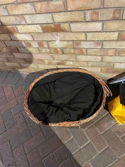 Photo of free Small wicker dog bed with cushion. Some damage due to chewi (Newtown SG16) #1