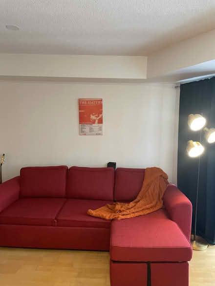 Photo of free red sofa-bed with storage (255 Richmond St. East) #2