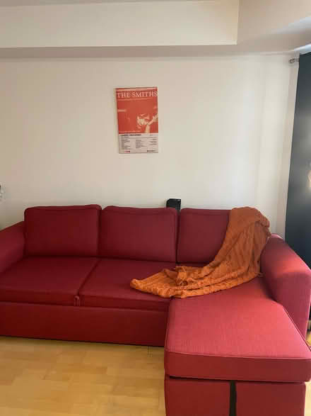 Photo of free red sofa-bed with storage (255 Richmond St. East) #1