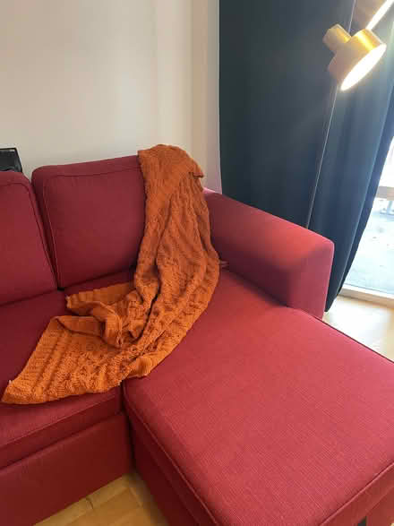 Photo of free red sofa-bed with storage (255 Richmond St. East) #4