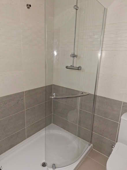 Photo of free 2 large shower screens, 1 curved and 1 straight (Spondon DE21) #1