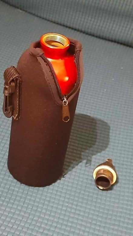Photo of free Large metal Sigg bottle & jacket (Maybury Hill GU22) #2