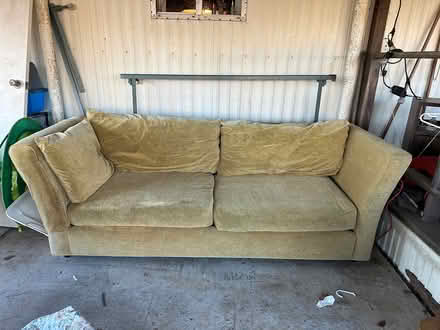 Photo of free Goldenrod colored long sofa (McKinleyville airport) #1