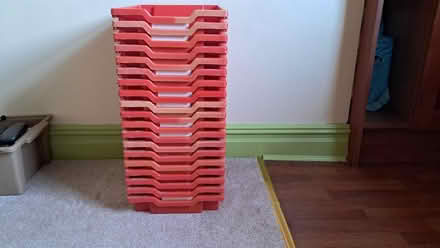 Photo of free Stack of red plastic trays (Bramley LS13) #1