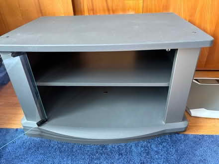 Photo of free Swivel TV Stand w/ glass latch door (Greece, NY) #1