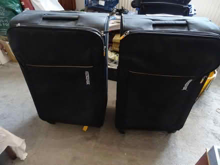 Photo of free 2 Large Black Suitcases (Creekmoor BH17) #1