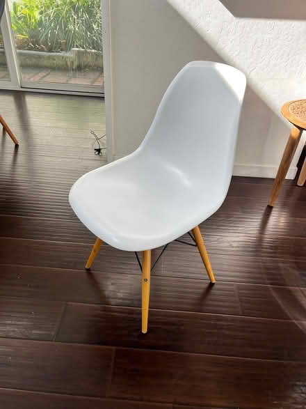 Photo of free White plastic molded chair (Wolfe and Evelyn) #1