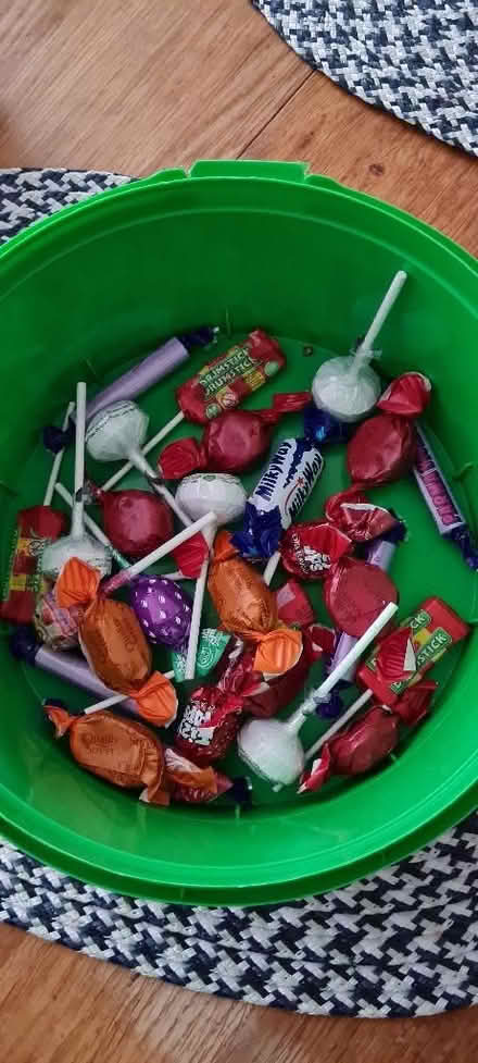 Photo of free Lollipops and orange/red quality streets (The Camp AL4) #1
