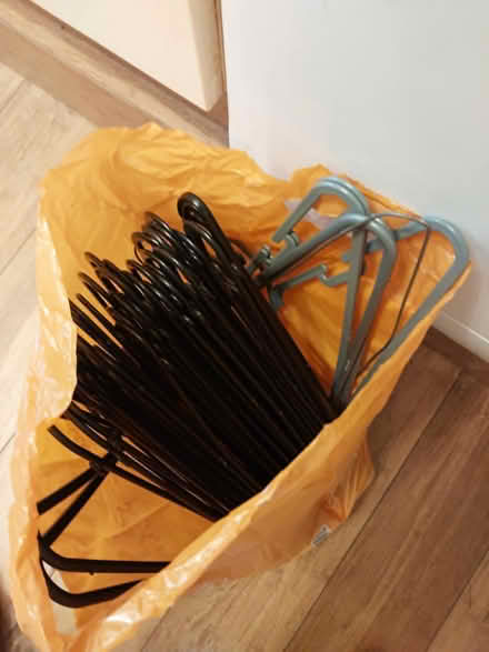 Photo of free Bag of assorted clothes hangers. (Warkton NN16) #1