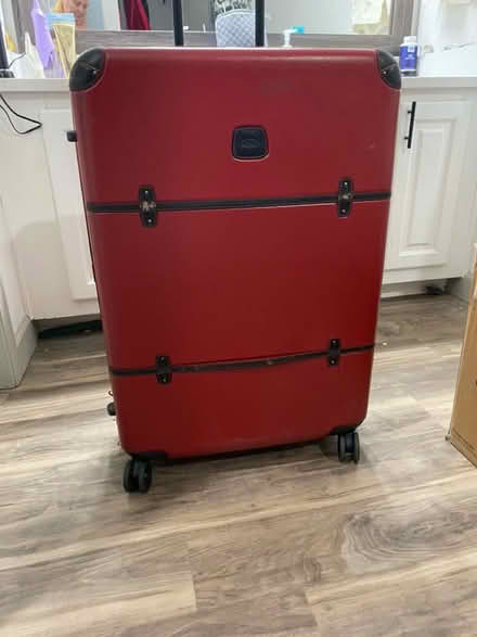 Photo of free Large red suitcase (McCaslin/I-36) #1
