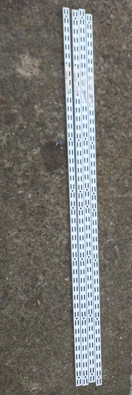 Photo of free 4 shelving uprights/ 12 shelf brackets (Craig-y-don LL30) #2