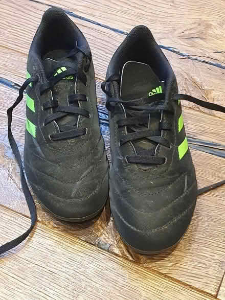 Photo of free Football shoes blk/grn size 2 studs (High Barnet) #1