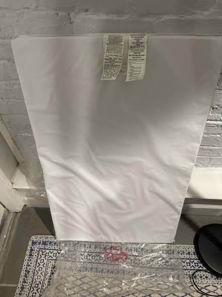 Photo of free Mini crib mattress pad (new) (Bloomingdale) #1