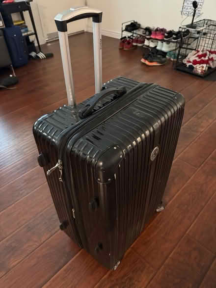 Photo of free Large black suitcase (Mid City / Koreatown) #2