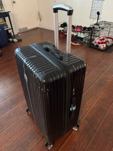 Photo of free Large black suitcase (Mid City / Koreatown) #3