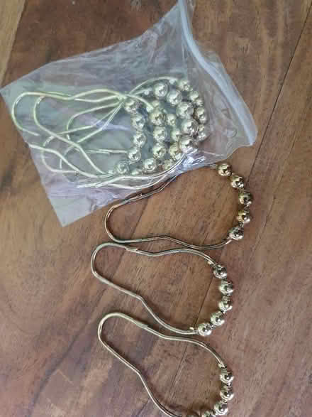 Photo of free Metal, foot-shaped shower curtain rings, gold-tone x 8 (Hungerford RG17) #1