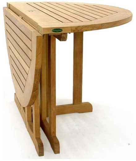 Photo of free Round Teak Folding Table (Cap Hill) #1