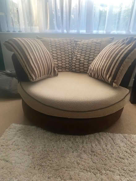 Photo of free DFS swivel chair with cushions (Staines) #1