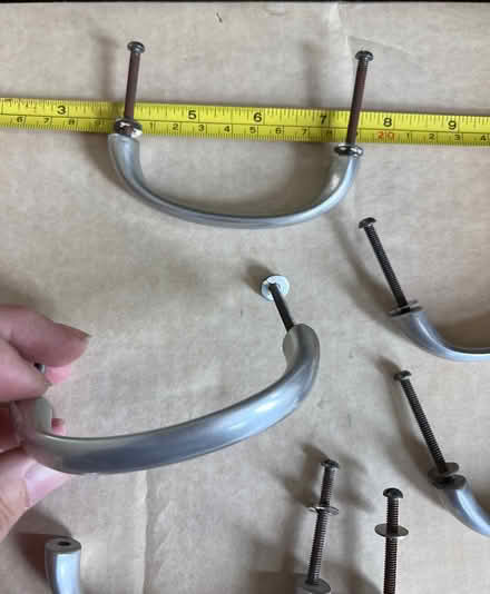 Photo of free 6 chrome/silver colour drawer pulls (Norham Manor OX2) #1