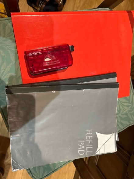 Photo of free Red A4 ring binder and hole punch (Chiswell Green) #1