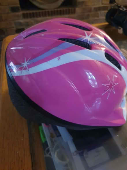 Photo of free A pink and white child's helmet (St Pauls Ward GU15) #1