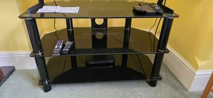 Photo of free Black glass TV stand (North Holmwood RH5 4JW) #1