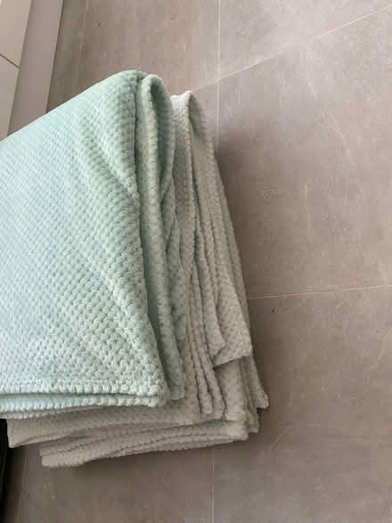 Photo of free XL mint green cosy throws x 3 (Fulham Palace Rd SW6) #1