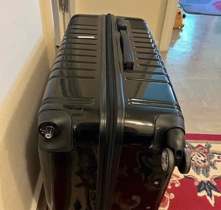 Photo of free Solid Suitcase - missing a wheel (Feltham) #2
