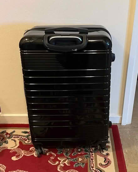 Photo of free Solid Suitcase - missing a wheel (Feltham) #1