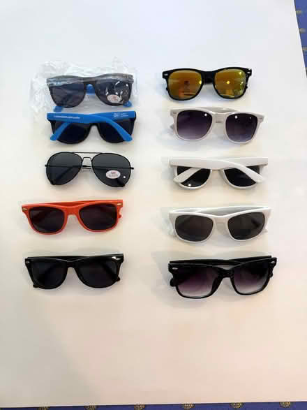 Photo of free Ten plastic adult sunglasses (Potomac, MD) #1