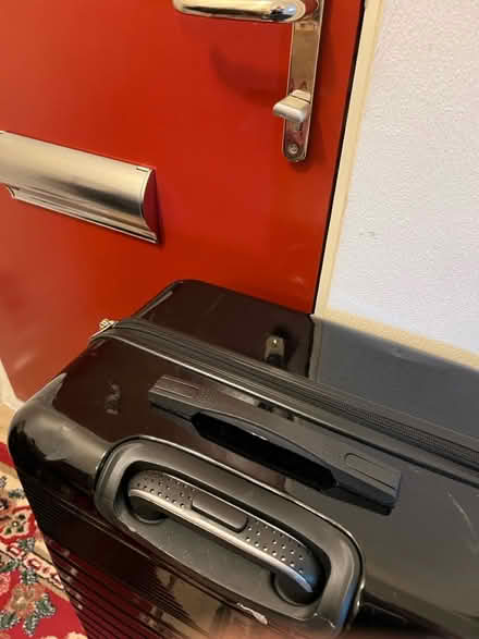 Photo of free Solid Suitcase - missing a wheel (Feltham) #3