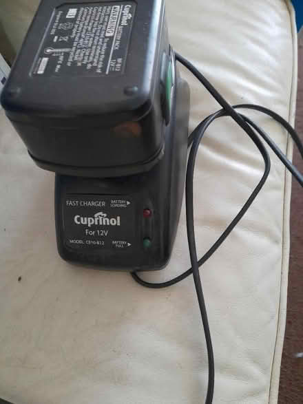 Photo of free Cuprinol 12v charger and battery (Addlestone KT15) #1