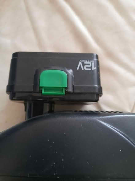 Photo of free Cuprinol 12v charger and battery (Addlestone KT15) #2
