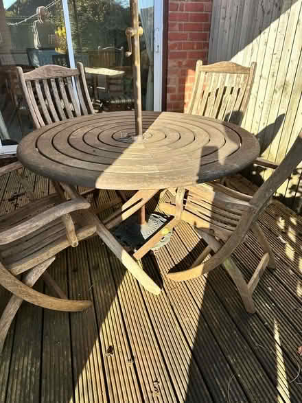 Photo of free Round teak garden table with umbrella (Whoberley CV5) #2