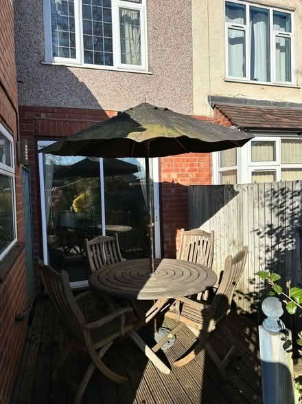 Photo of free Round teak garden table with umbrella (Whoberley CV5) #1