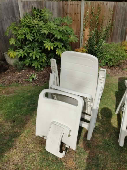 Photo of free 2 white plastic sun loungers with footrest and drinks tray (Hanworth RG12) #1