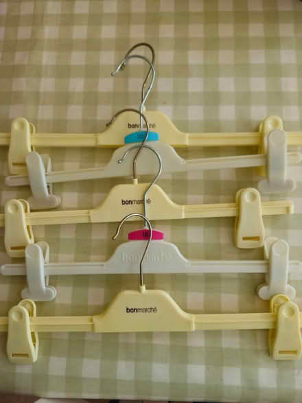 Photo of free 5 white/cream plastic skirt hangers (Walton) #1