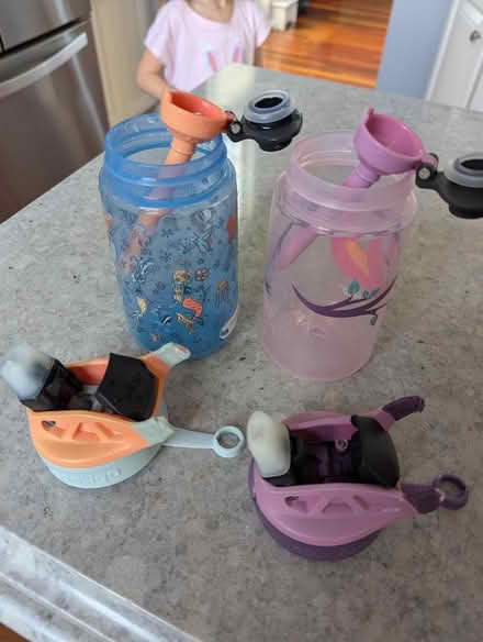 Photo of free Water bottles/broken handle (63rd& main, DG) #1